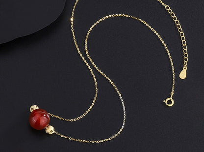 Elegant Red Jade Bead Necklace with Gold Accents