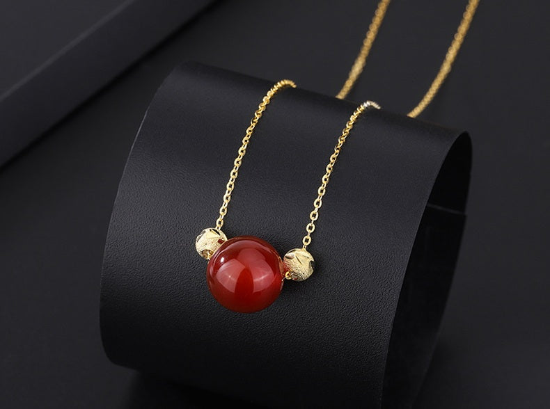 Elegant Red Jade Bead Necklace with Gold Accents